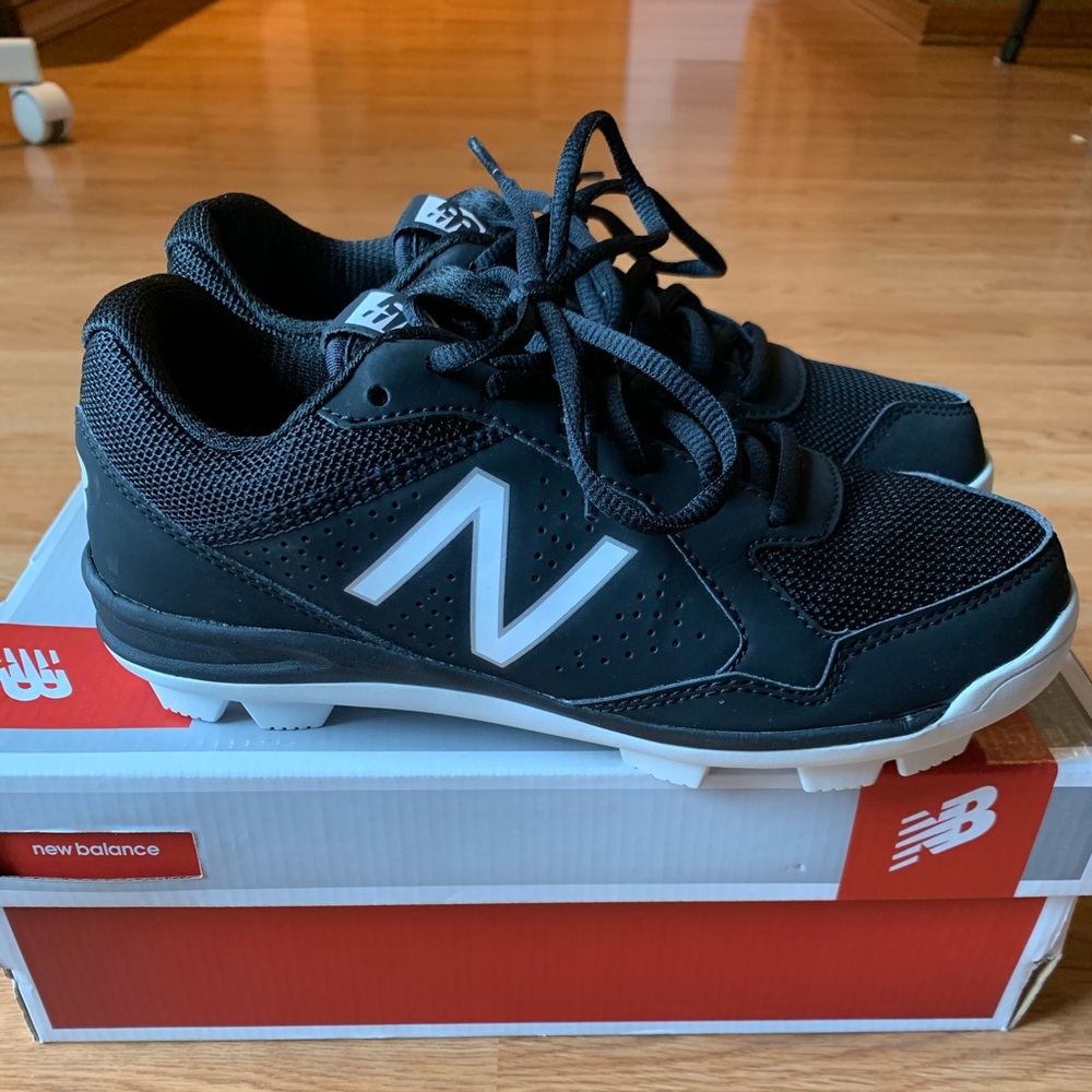 New in box New Balance cleats, 4.5Y